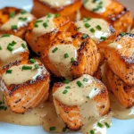 Crispy Bang Bang Salmon Bites on platter with sauce