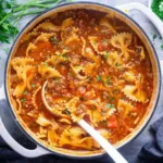 Lasagna soup with melted cheese and basil