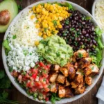 Delicious Chicken Burrito Bowl recipe with rice, beans, chicken, and toppings