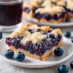 Delicious blueberry pie bars fresh out of the oven with a golden crust.