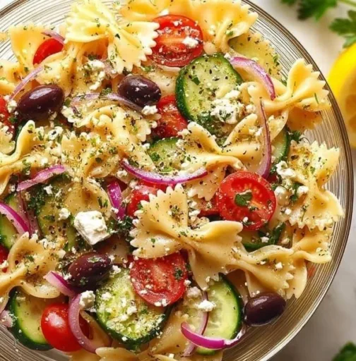 Delicious feta Mediterranean pasta salad with colorful vegetables and feta cheese.
