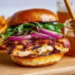 Delicious grilled chicken sandwich with fresh toppings and side fries