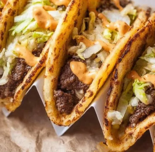 Delicious smash burger tacos served with fresh toppings and sauces