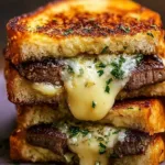 Delicious steak grilled cheese sandwich on a plate