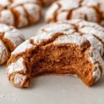 Delicious Gingerbread Crinkle Cookies topped with powdered sugar