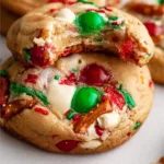 Homemade kitchen sink cookies with chocolate chips and nuts on a cooling rack.