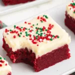 Delicious Red Velvet Cookie Bars topped with cream cheese frosting